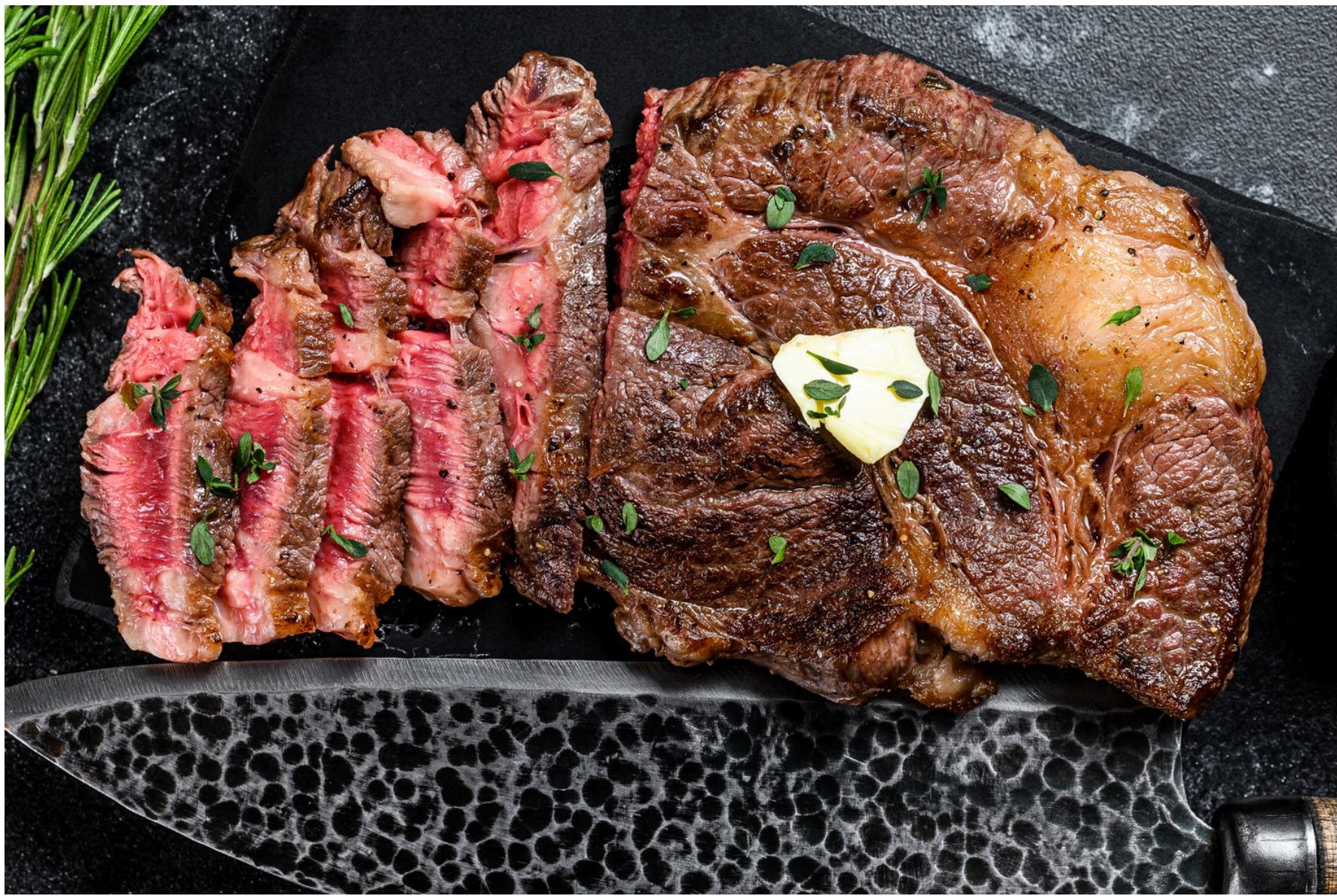 Cooked chuck eye steak with butter and herbs